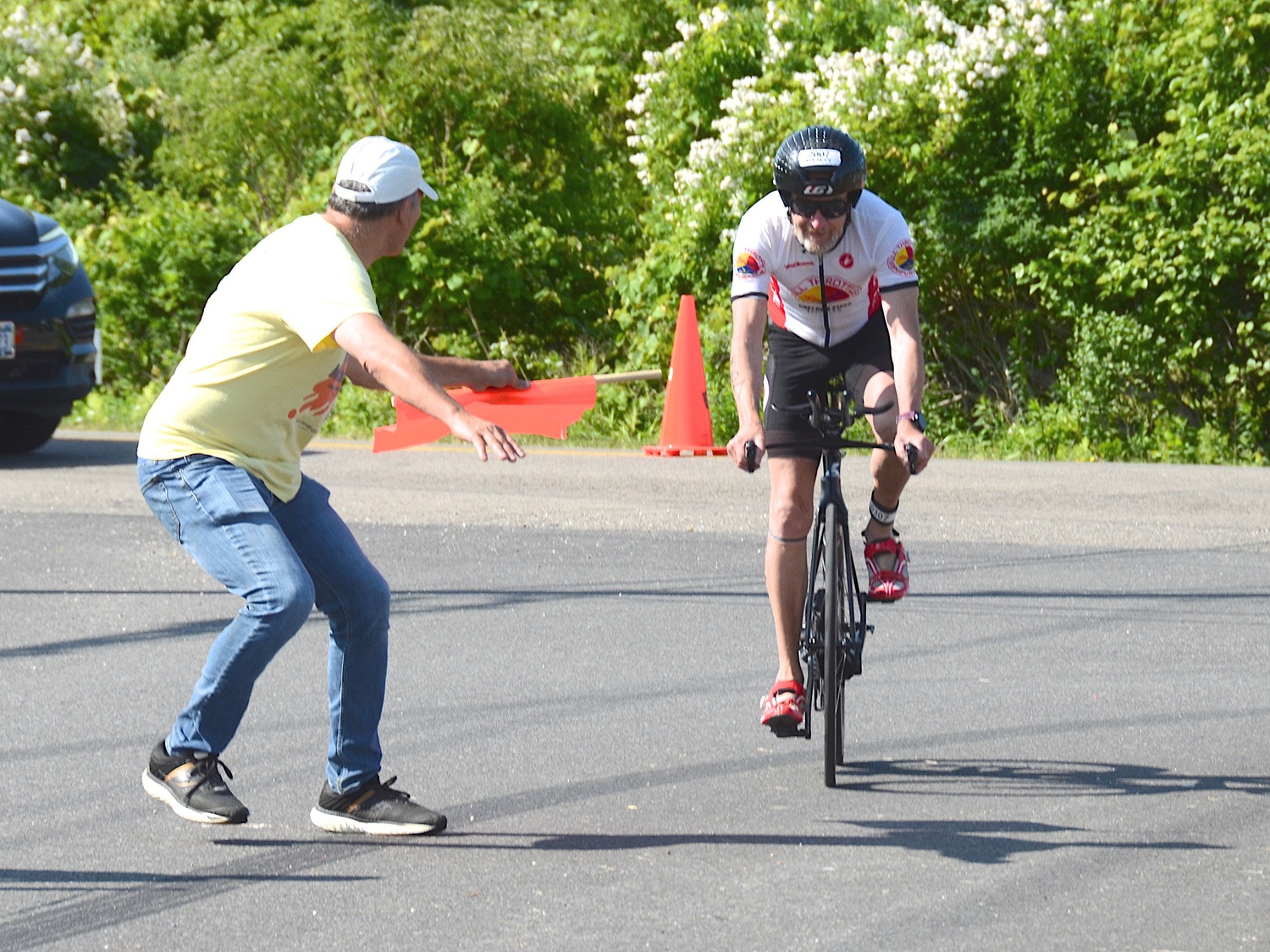 Triathletes make the transition from the bike to the run portion.   KYRIL BROMLEY