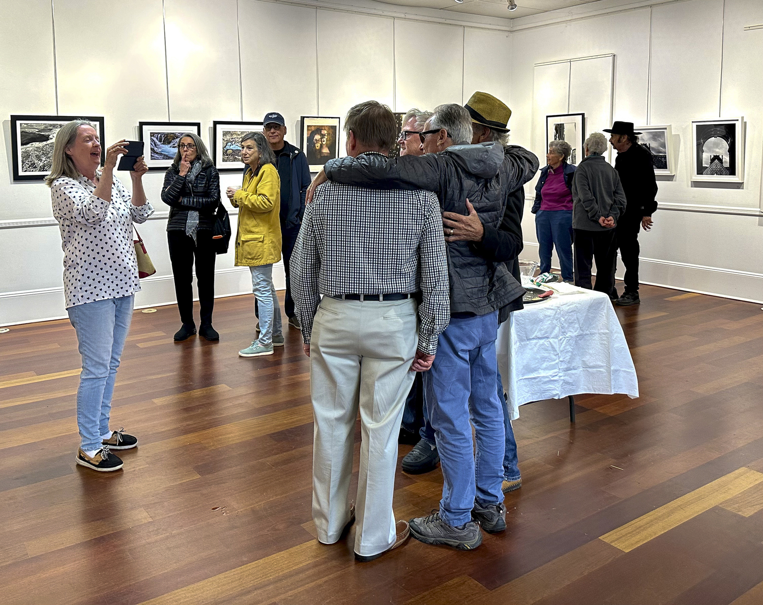 Guests at the opening of the East End Photographers Group Spring Photography Exhibition, which ran June 3 to 11 at Ashawagh Hall in East Hampton. COURTESY EEPG