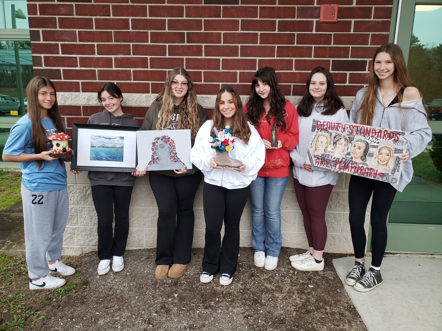 Eastport-South Manor Jr.-Sr. High School student-artists, from left, Alexa Flood, Ryann Palumbo, KatieAnne Giusto, Jessica Barca, Gianna Rando, Keira Bree, Reagan Walsh were among those selected to exhibit their artwork at the BAFFA juried high school competition and exhibition.  COURTESY EASTPORT-SOUTH MANOR SCHOOL DISTRICT