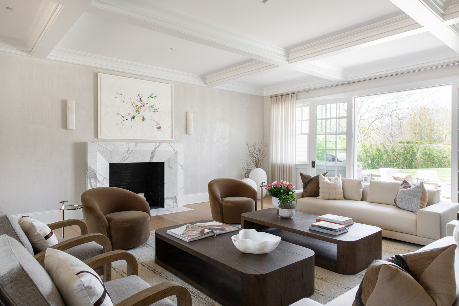 The living room features quiet neutrals, a theme used throughout the house. LENA YAREMENKO