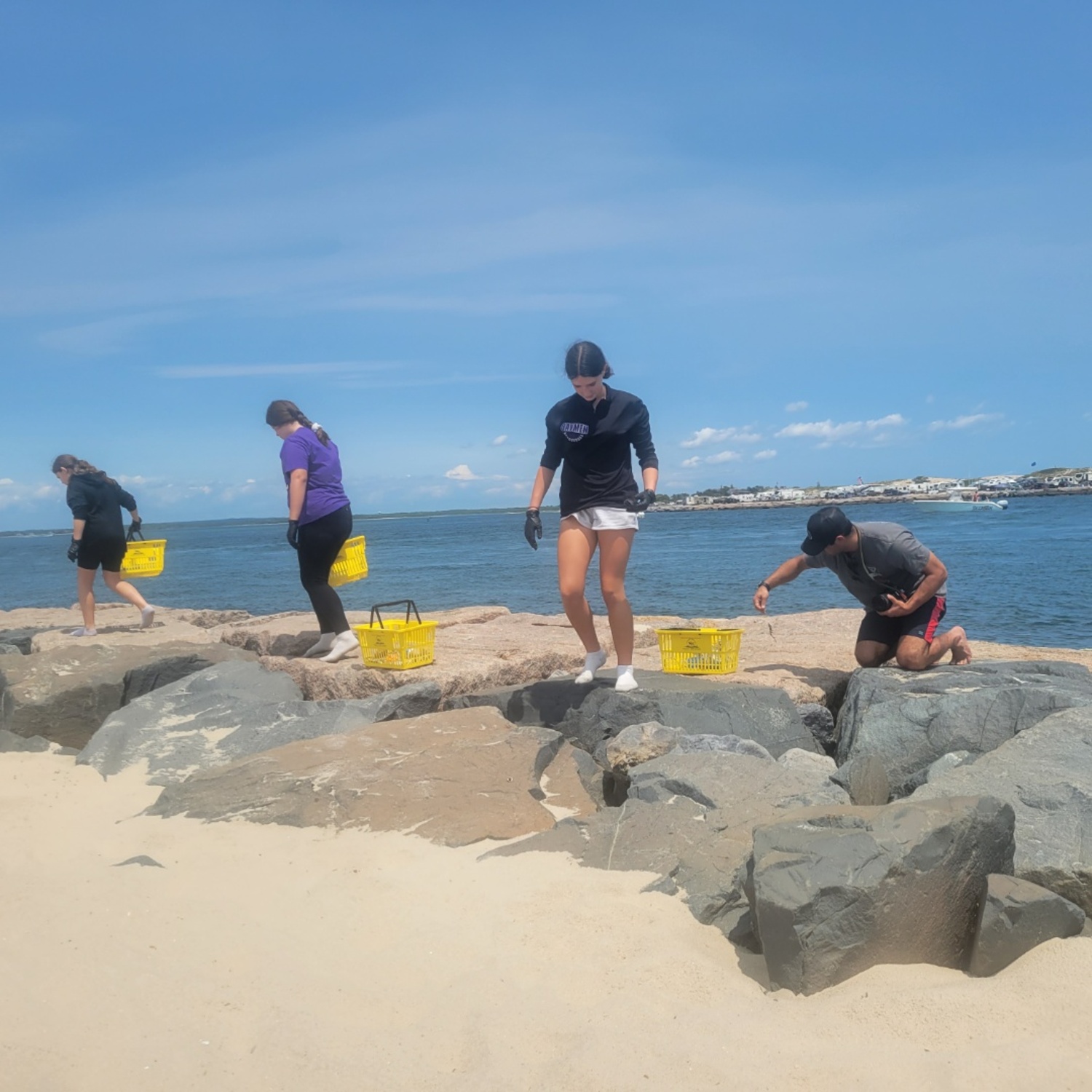 All 41 members of the Hampton Bays Middle School National Junior Honor Society spearheaded a Hampton Bays Volunteer Community Service Day on June 10. During the day, students and chaperones volunteered at various locations throughout the community to help in meaningful ways. Volunteers assisted at the Hampton Bays Public
Library, the Hampton Bays Ecological Culture Initiative, the Evelyn Alexander Wildlife Rescue Center, and the Long Island Cares Hunger Assistance and Humanitarian Center of the Hamptons. They also participated in a trash cleanup at Red Creek Park, a beach cleanup at Ponquogue Beach, and letter-writing campaigns for the Hampton Bays Senior Center's Meals on Wheels program and St. Jude Children's Research Hospital patients. In addition, they worked on an art installation at their school related to diversity, equity and inclusion. COURTESY HAMPTON BAYS SCHOOL DISTRICT