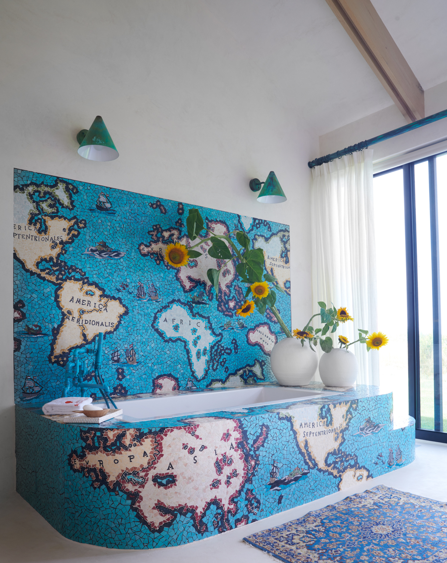 The primary bath has an extraordinary mosaic tub surround. WILLIAM WALDRON