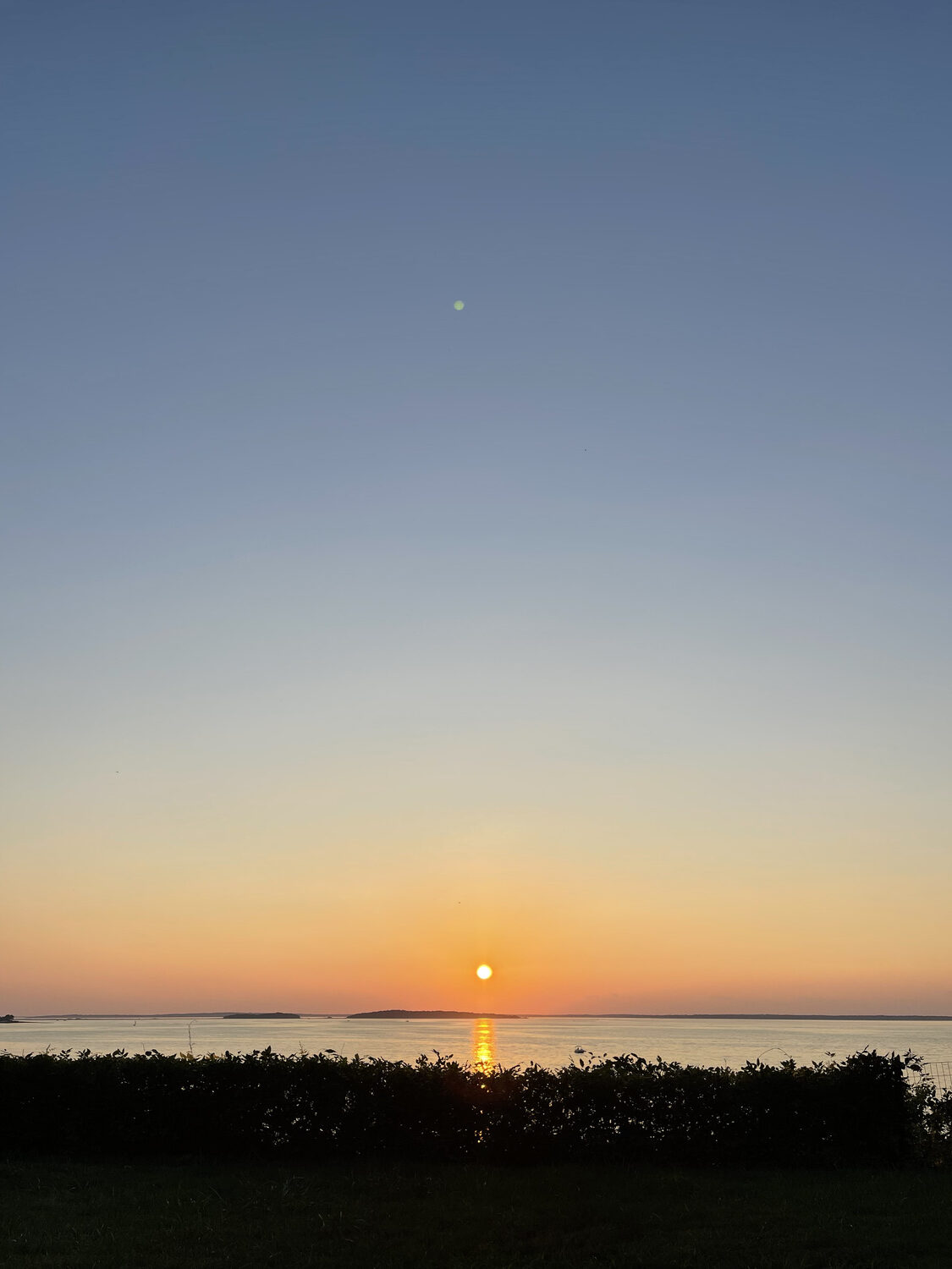 The billion-dollar sunset view from the Sanders’ modest Bay Point cottage.  BRIAN BAILEY