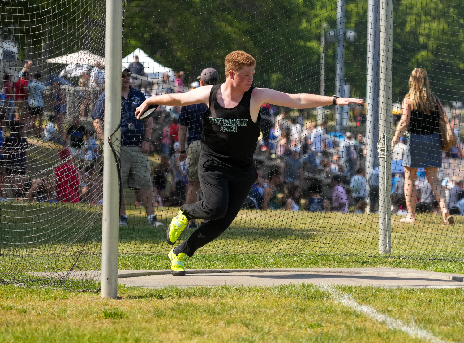 Westhampton Beach junior Jack Hendrickson performs in the discus at the state qualifier.   RON ESPOSITO