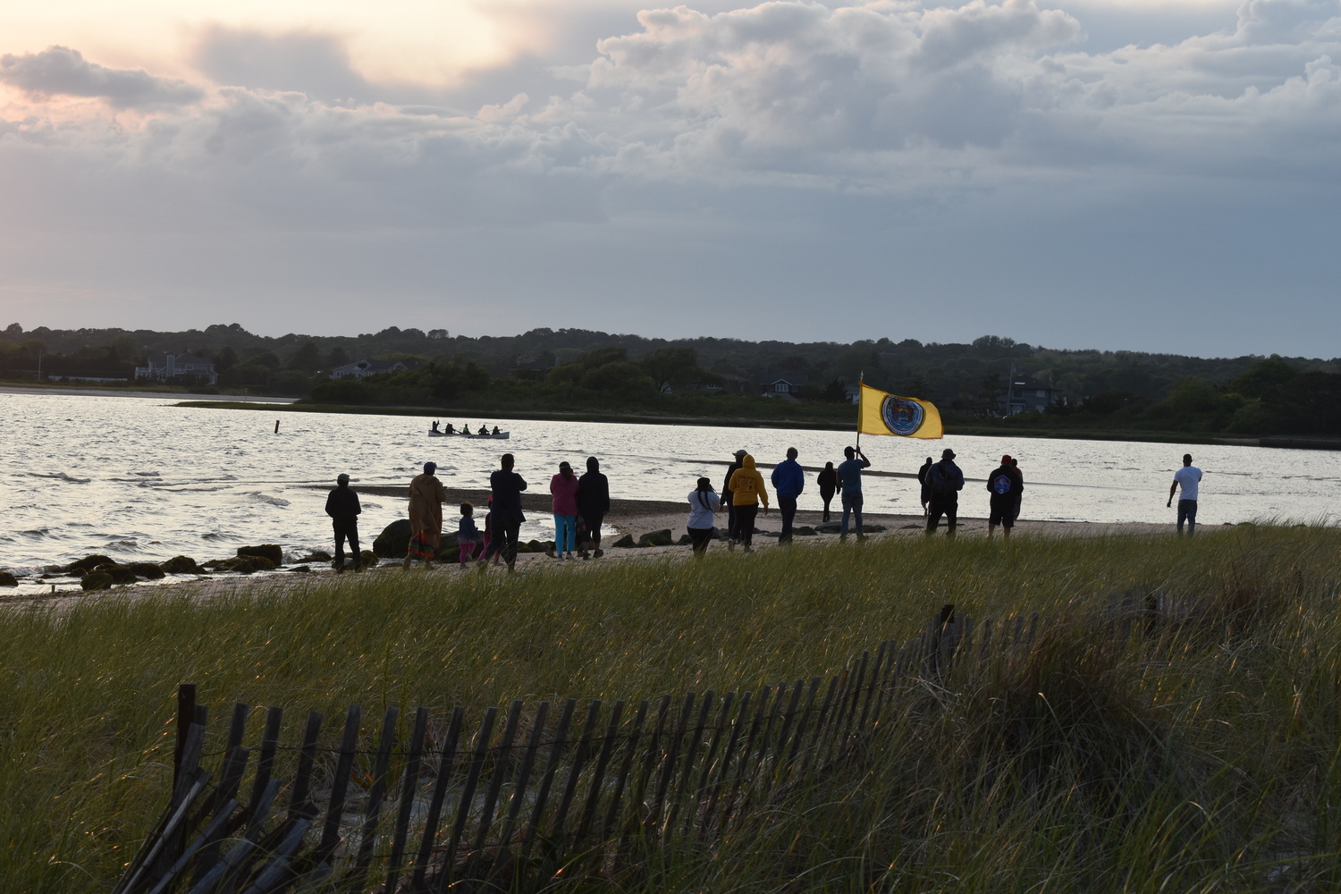 Members of the Shinnecock Nation gathered at Cuffee Beach to welcome home the paddlers after their canoe was swamped in Shinnecock Canal. STEPHEN J. KOTZ