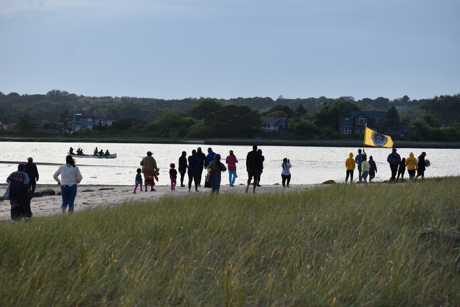 Members of the Shinnecock Nation gathered at Cuffee Beach to welcome home the paddlers after their canoe was swamped in Shinnecock Canal. STEPHEN J. KOTZ