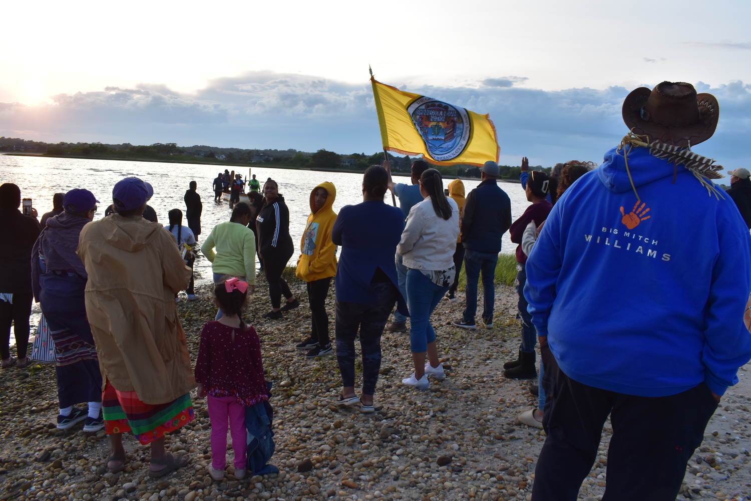 Members of the Shinnecock Nation gathered at Cuffee Beach to welcome home the paddlers after their canoe was swamped in Shinnecock Canal. STEPHEN J. KOTZ