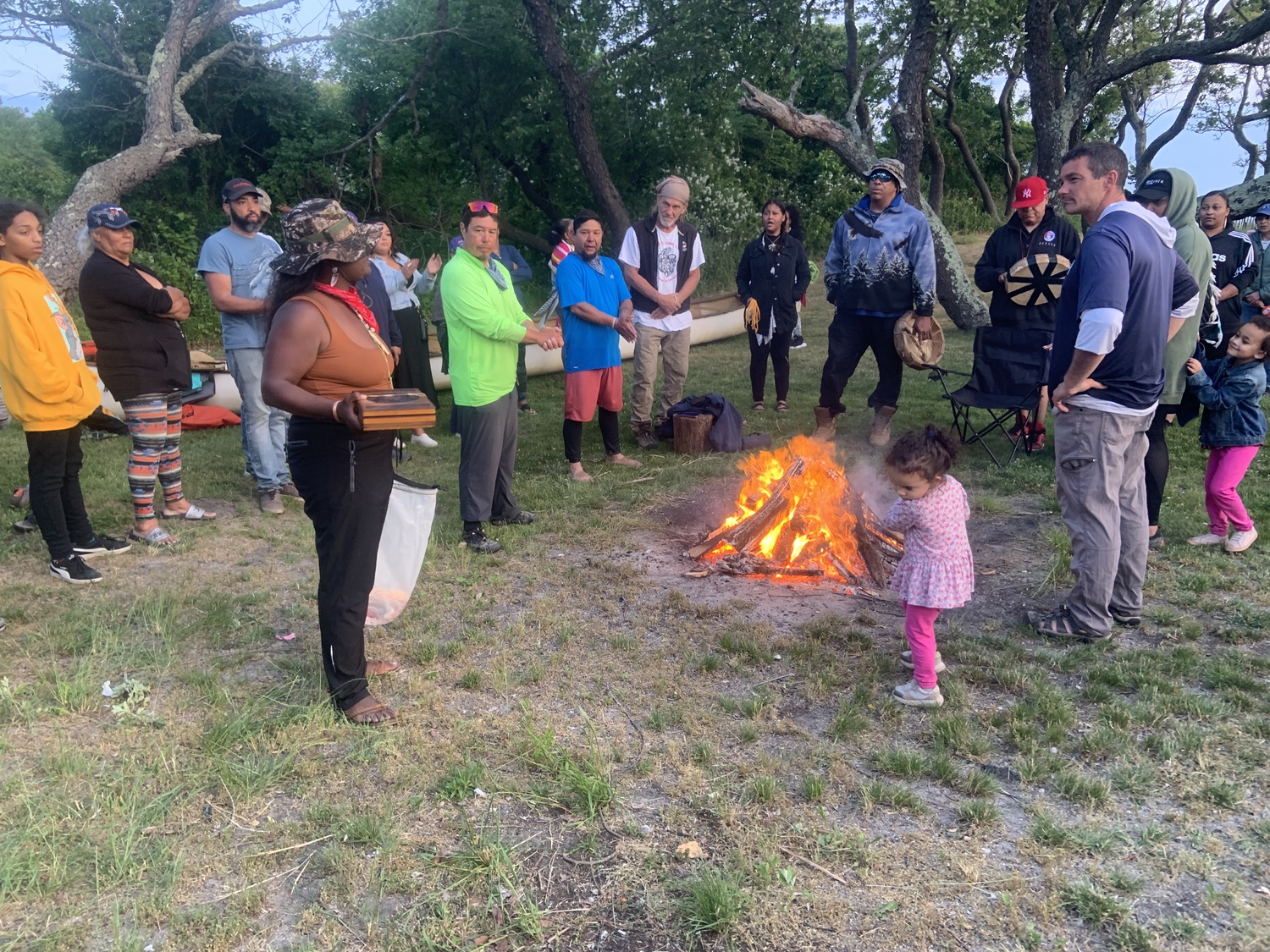 Members of the Shinnecock Nation gathered at Cuffee Beach to welcome home the paddlers after their canoe was swamped in Shinnecock Canal. STEPHEN J. KOTZ