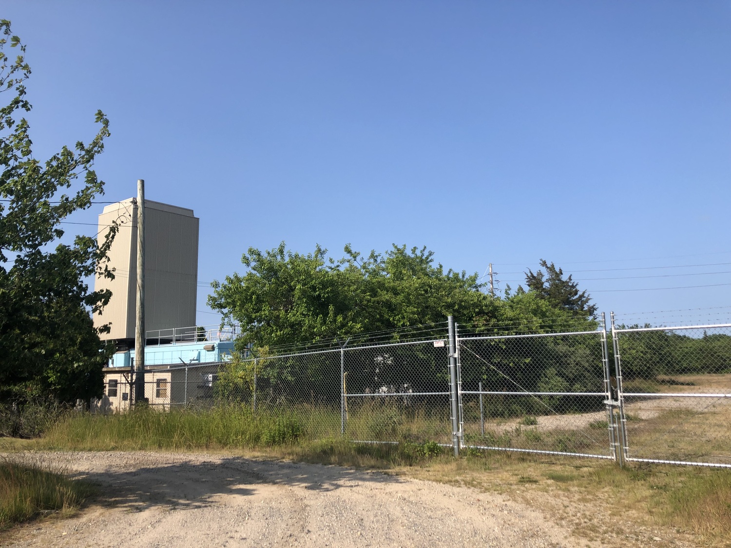 An old Keyspan site, no longer in use, off David White's Lane south of County Road 39, behind the old Cancos Tile building, could potentially work as the site for a sewage treatment plant that is necessary for completing the Southampton Village Sewer District. CAILIN RILEY