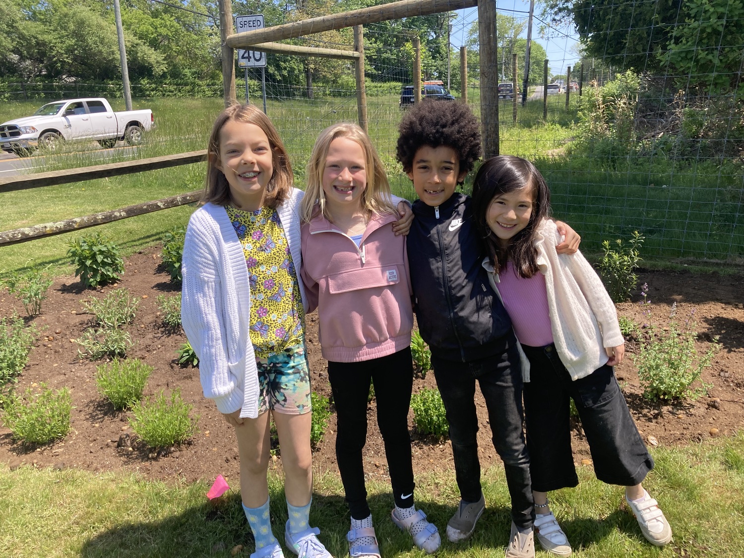 Sagaponack School students were invited to the Sagaponack Village Hall to help plant flowers in its new pollinating garden. Participating students included, from left, Ella Thofte, LouLou Fenwick,  Luca Zeledon and Olivia Schwartz-Kinder. COURTESY SAGAPONACK SCHOOL