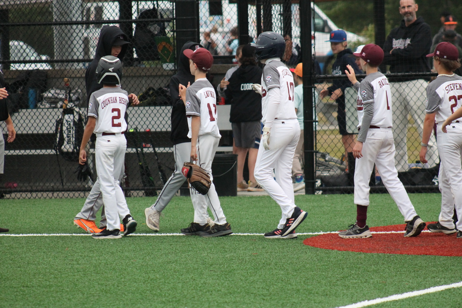 The East Hampton and Southampton 12U baseball All-Stars shake hands after last week's games.  KRIS VINSKI