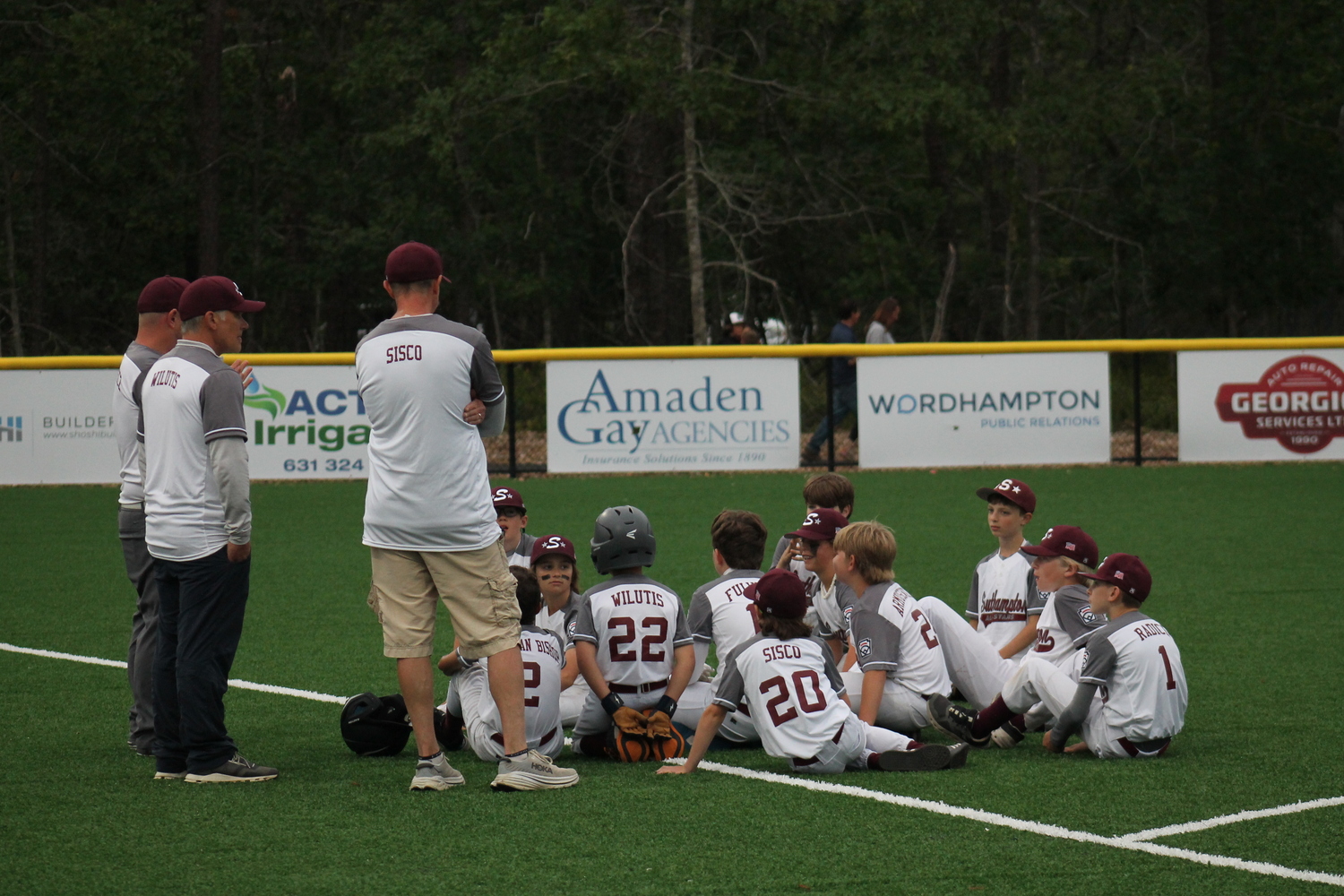 Southampton's 12U All-Stars discuss things after its 9-0 loss to East Hampton on June 22. KRIS VINSKI