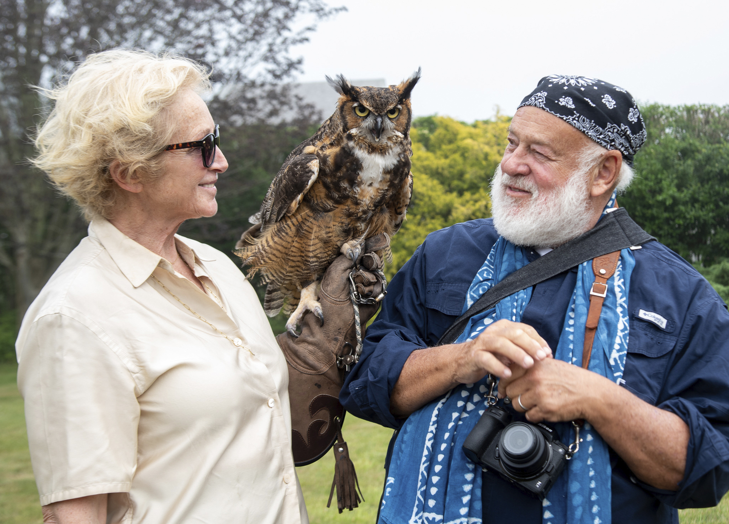 Jane Gill and Bruce Weber with Meep, a great horned owl.