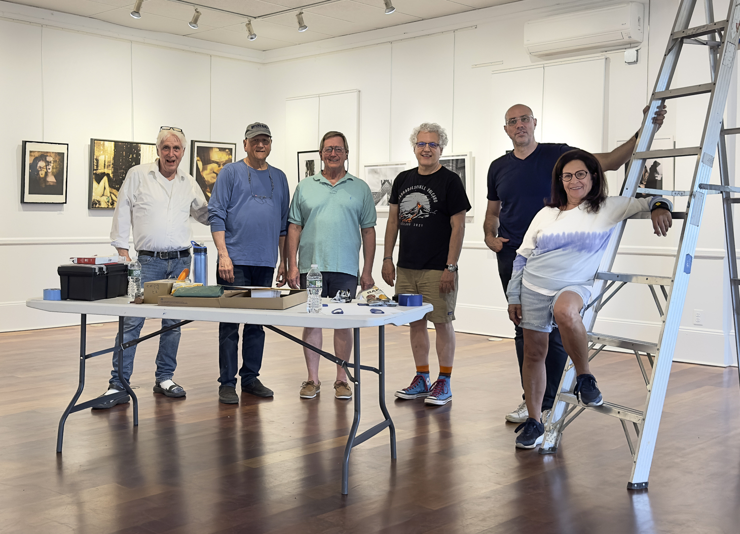 East End Photographers Group members hanging the recent show. From left, Richard Law, Gerry Gilberti, Ron Buchter, Keith Manning, Mark Testa and Marilyn Stevenson. COURTESY EEPG