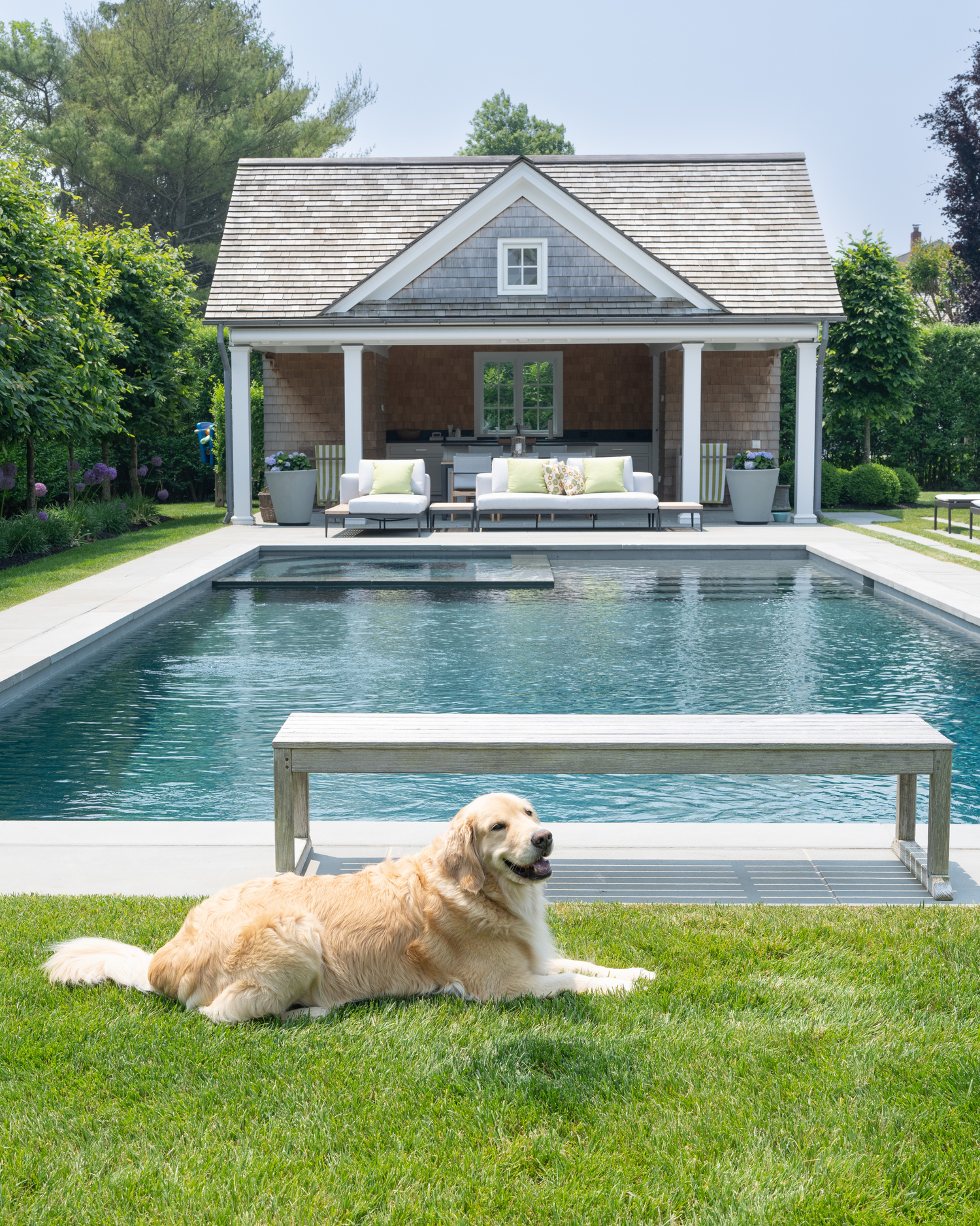 The pool house provides shaded alfresco dining. LORI HAWKINS