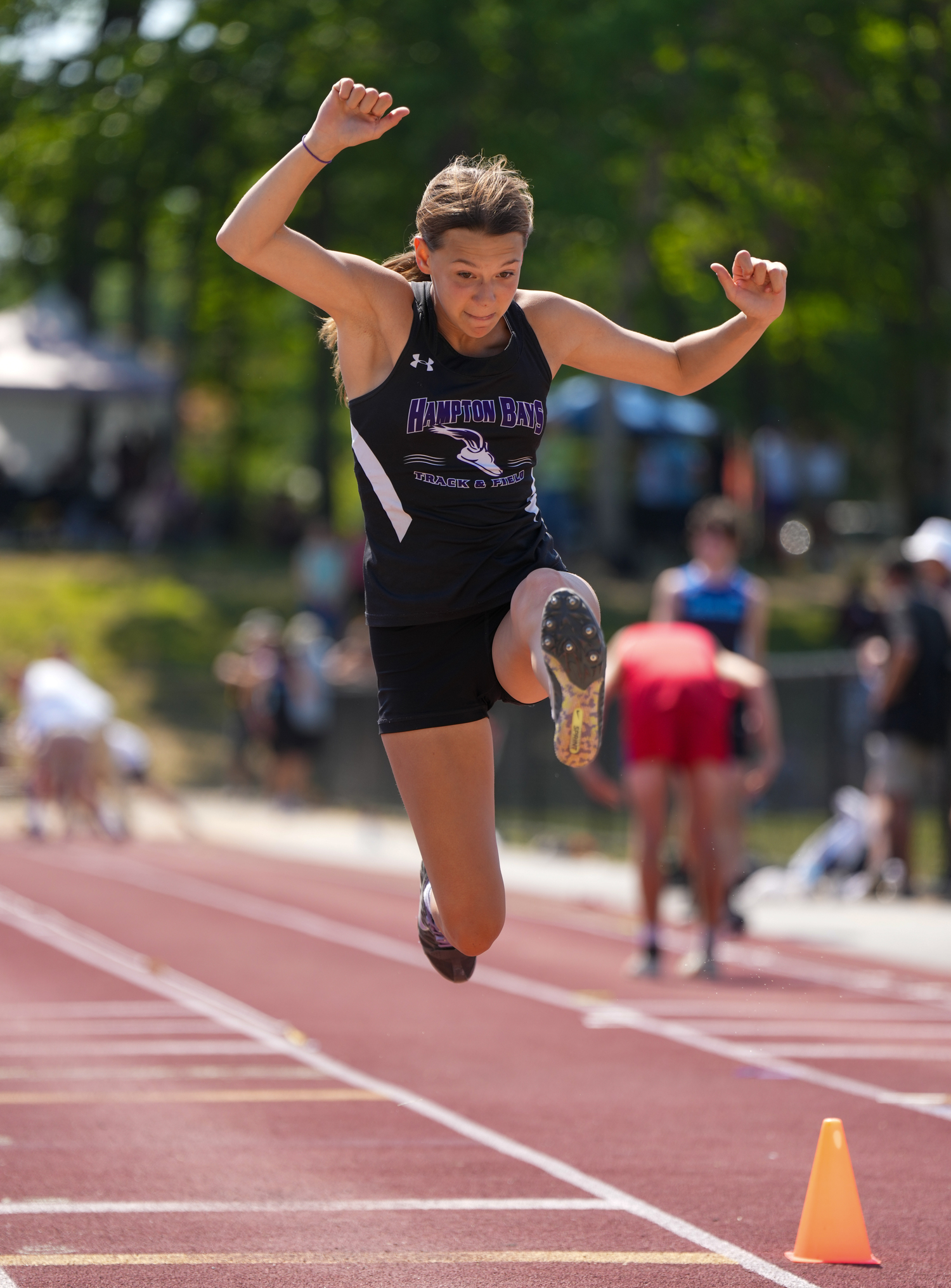 Hampton Bays junior Allie O'Brien in the long jump portion of the pentathlon.   RON ESPOSITO