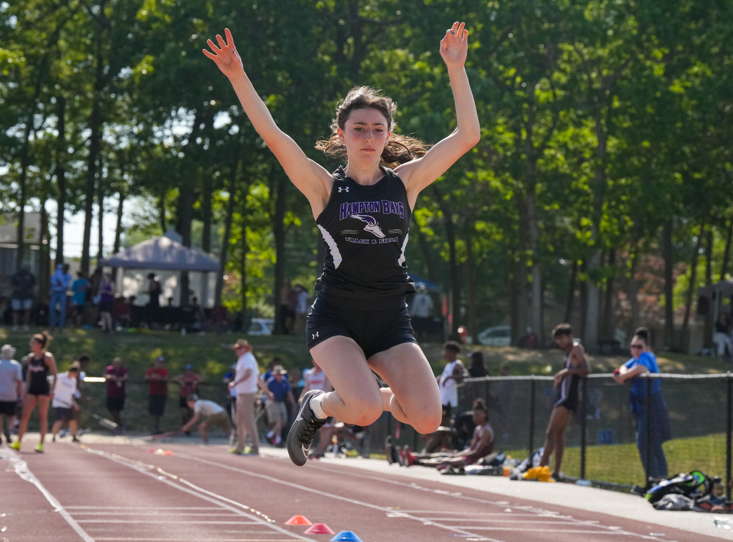 Hampton Bays junior Emma Halsey competing in the triple jump at last week's state qualifier.   RON ESPOSITO