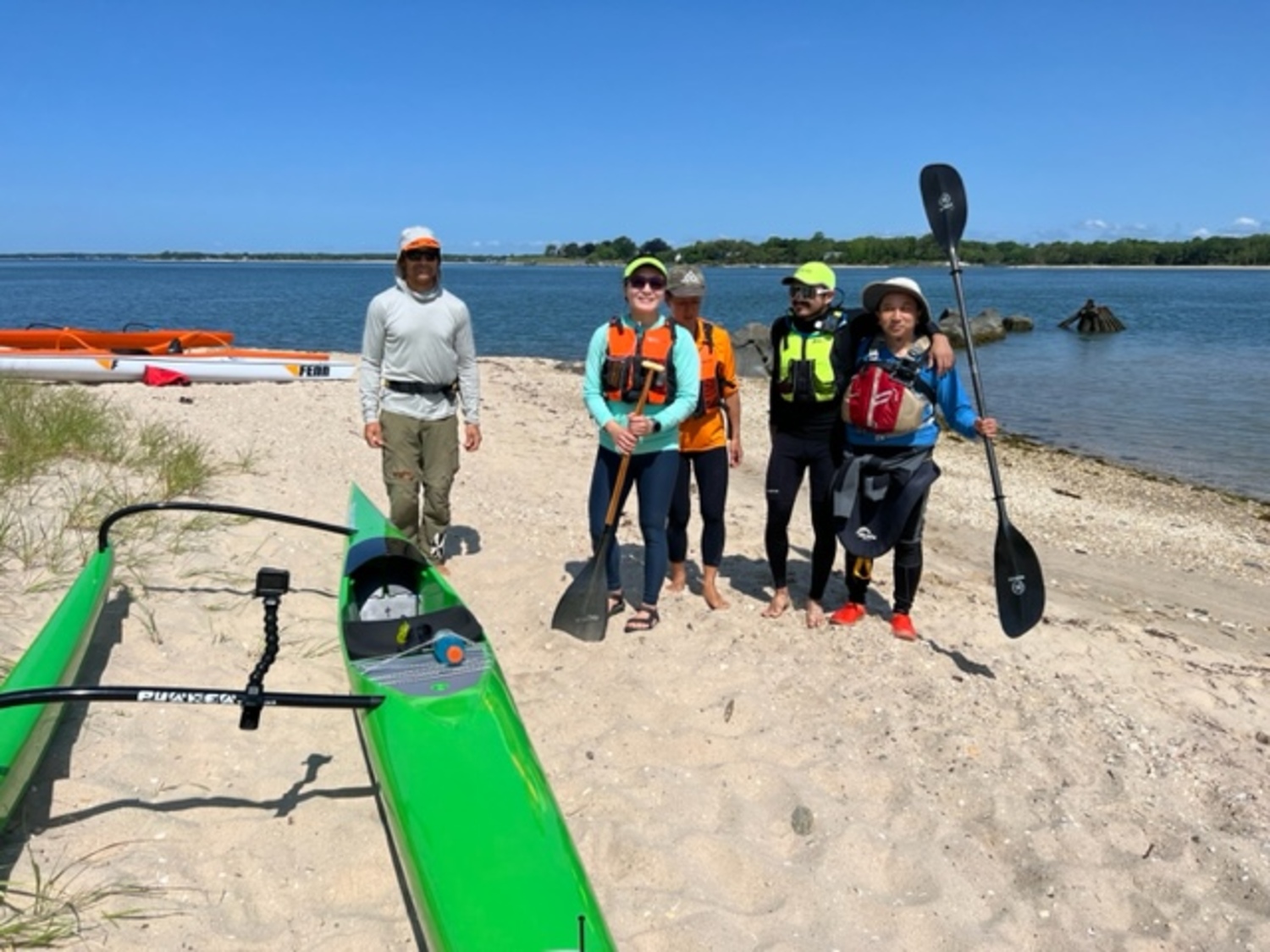 Several avid paddlers, from left, Jeremy Grosvenor, Stacy Wu, Carol Choi,  Ronald Rivera and Tuan Le, set out on June 9 to circumnavigate Shelter Island. It is 19 miles around the island and it takes about 4 to 5 hours to complete. That day the wind conditions were 10+ mph with cross winds creating a bumpy trip on the water. PHOTOS COURTESY JIM DREEBEN