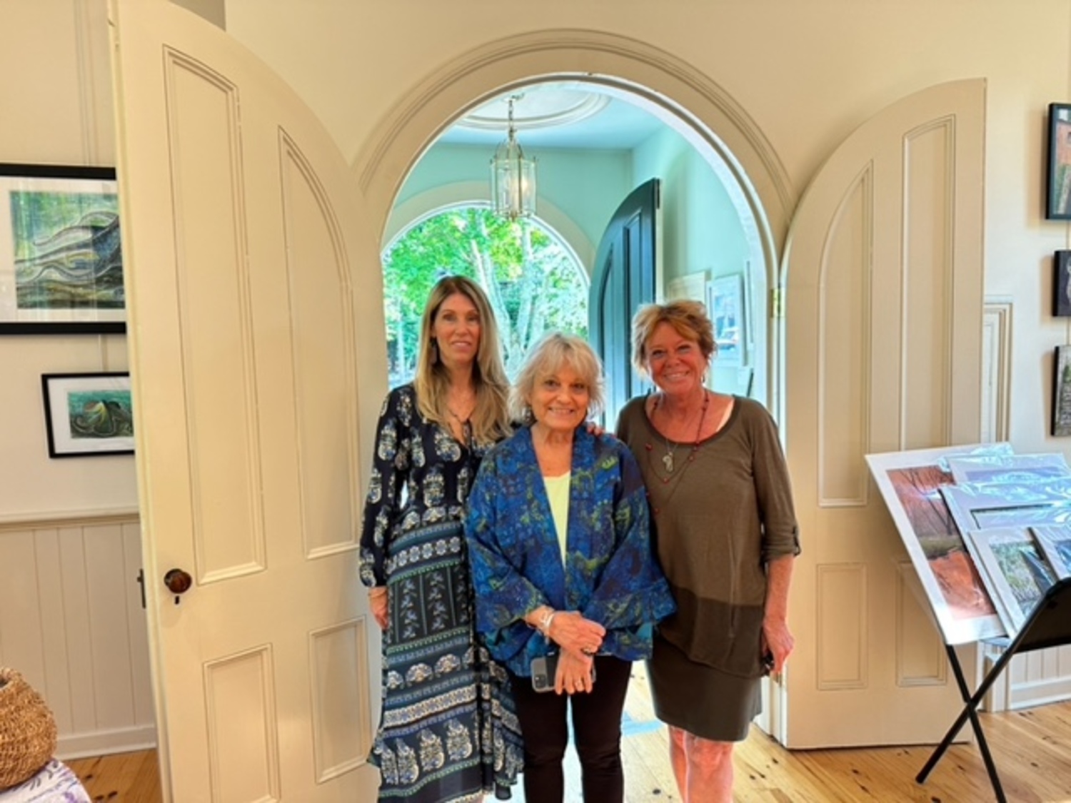 An opening reception for the art exhibit  “Land and Sea” was held at the Remsenburg Academy on Saturday. The show includes the works of, from left, Peggy Flaum and Ceil Frank and Chris Cohen. COURTESY REMSENBURG ACADEMY