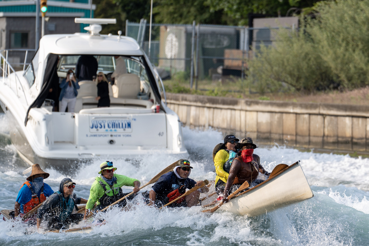 The canoe struggles in the Just Chillin's wake. REBEKAH PHOENIX WISE