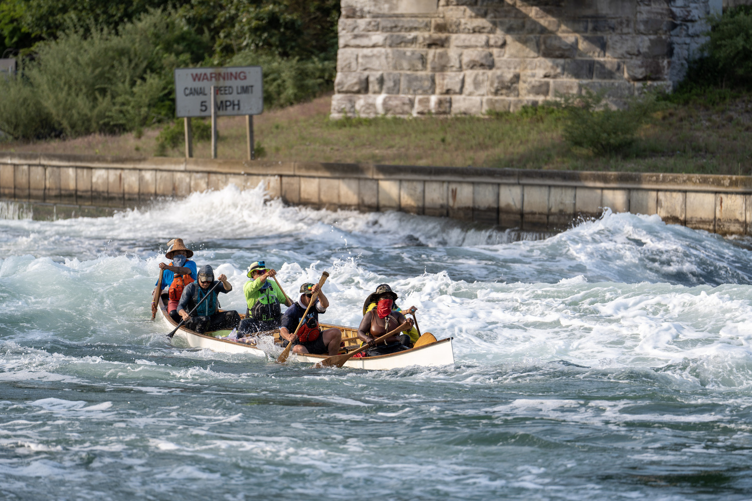 The canoe struggles in the Just Chillin's wake. REBEKAH PHOENIX WISE