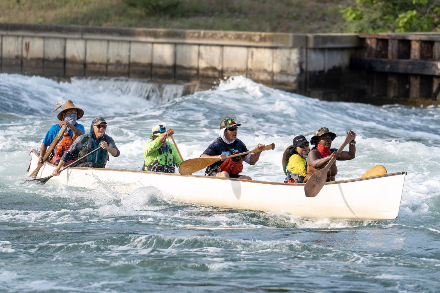 The canoe struggles in the Just Chillin's wake. REBEKAH PHOENIX WISE