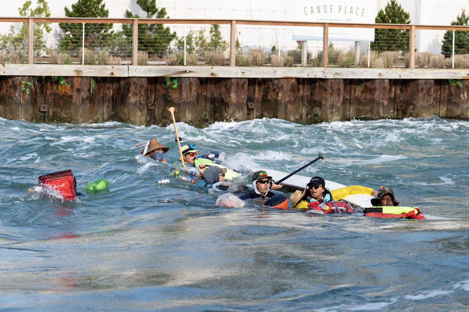 Crew members in the water after the canoe wa swamped and capsized. REBEKAH PHOENIX WISE