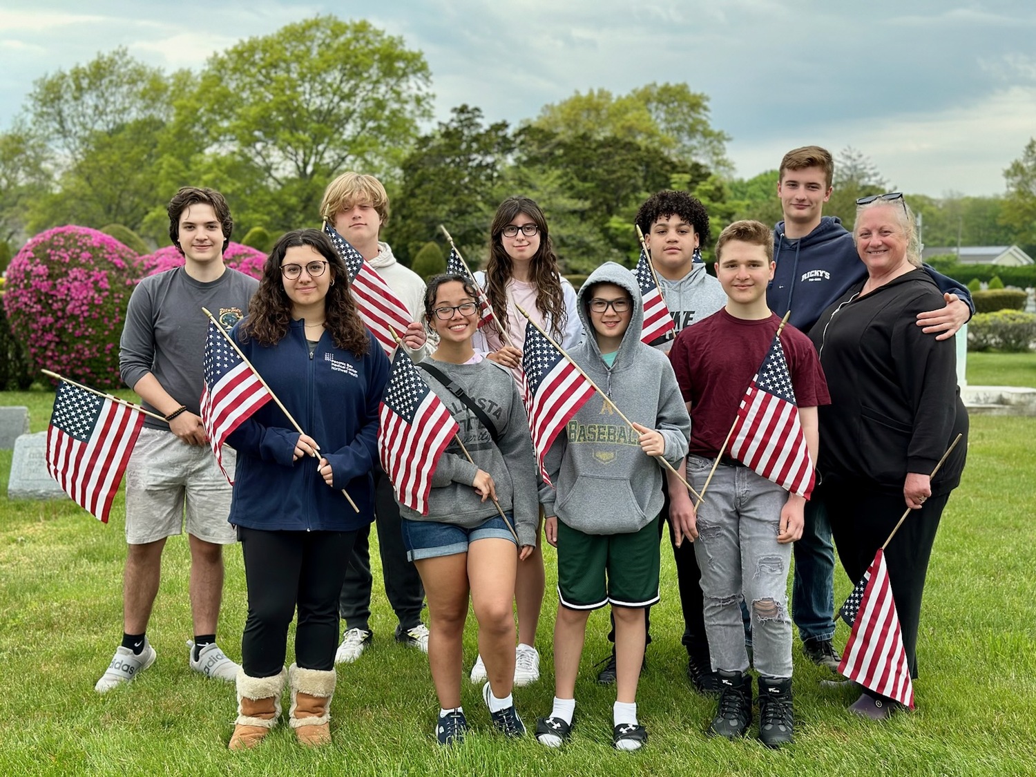 In honor of Memorial Day, members of Southampton High School’s Mariners Patriot Club continued their tradition of placing flags on the graves of veterans at Sacred Hearts Cemetery. The flags will be collected by the volunteers after Memorial Day. COURTESY SOUTHAMPTON SCHOOL DISTRICT