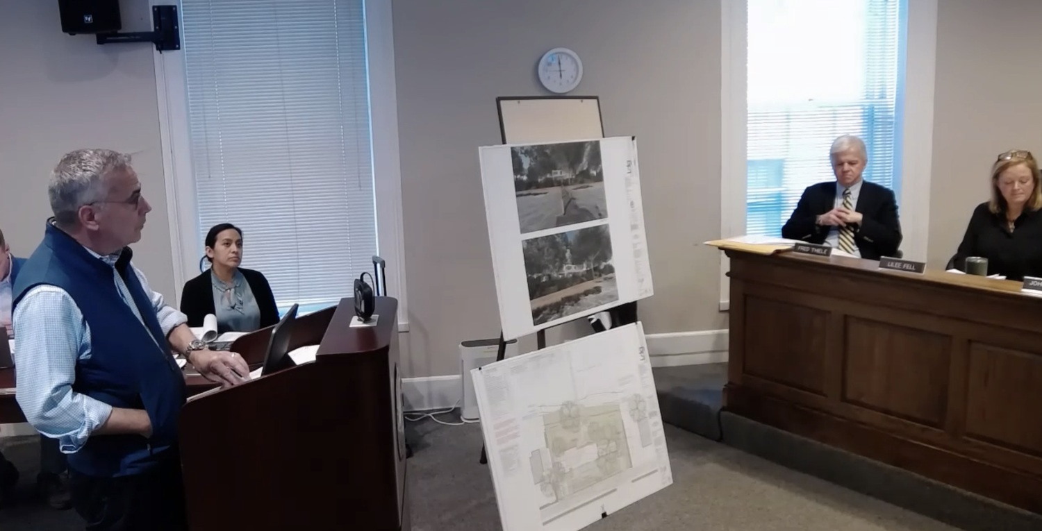 Landscape architect Christopher LaGuardia (left) explains plans to tear down the existing house and build a new structure and spa at 9 Bluff Point Lane to the Harbor Committee at its May 4 meeting. The panel granted a wetlands permit for the project at its following meeting on June 1.