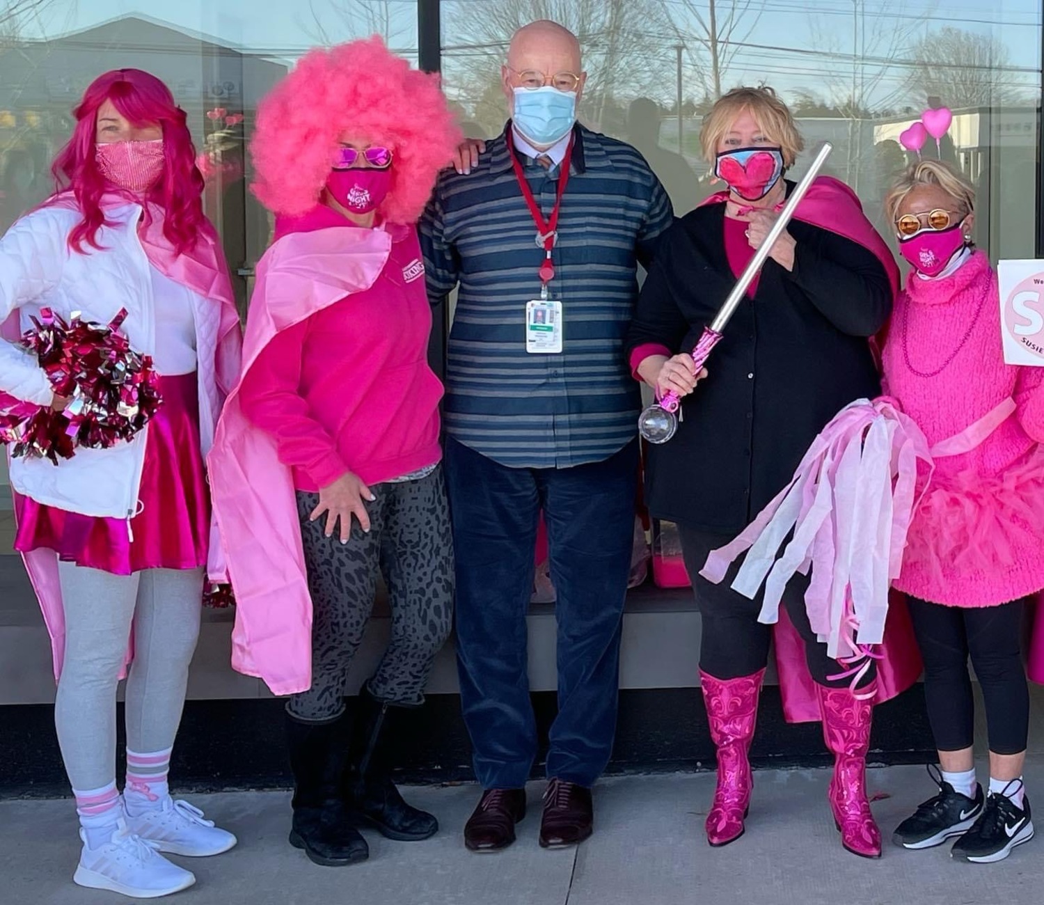 Susie Roden, president of the Coalition for Women’s Cancers at Stony Brook Southampton Hospital and vice president of Lucia’s Angels, clutches a saber and dons her famous pink boots as she heads into radiation, surrounded by her friends and radiation oncologist Dr. Edward Valentine.