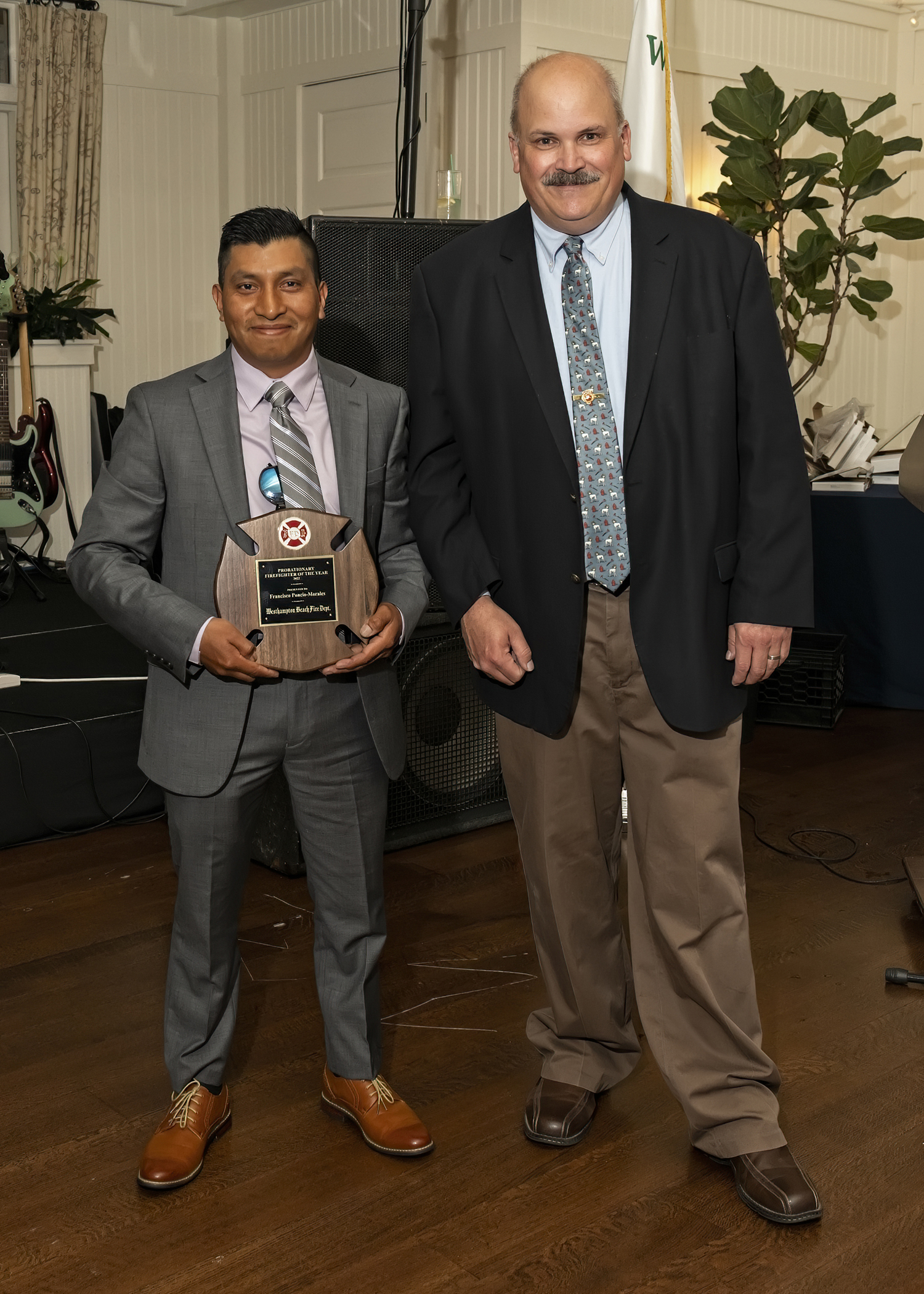 Francisco Morales-Poncio, left, with Chief Darryl Schunk, received the Probationary Firefighter of the Year Award  at the Westhampton Beach Fire Department annual dinner at the Westhampton Country Club on June2.    COURTESY WESTHAMPTON BEACH FIRE DEPARTMENT