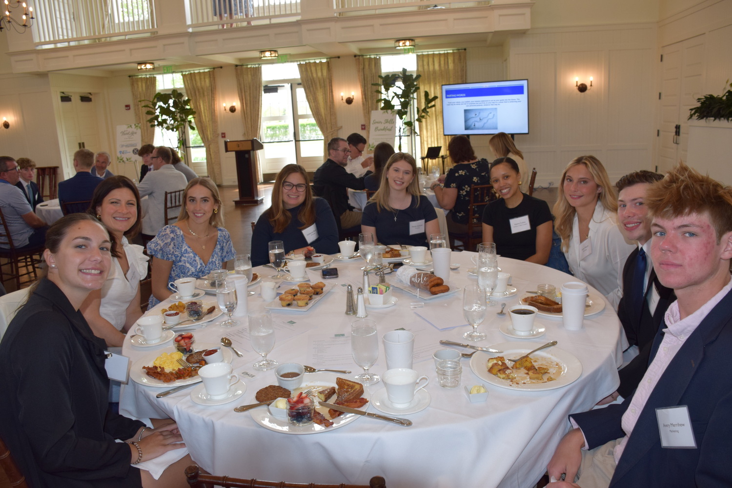 Westhampton Beach High School seniors, dressed in their best, learned more about
the careers they hope to pursue during the 19th annual Senior Skills Breakfast held at the
Westhampton Country Club on May 19.
During the breakfast, over 40 area professionals served as mentors and  shared their knowledge, experience and advice. Fields represented included medicine, science, engineering, film and finance. The event was planned by the Westhampton Beach Business Advisory Committee and sponsored by the Greater Westhampton Chamber of Commerce, Westhampton Kiwanis and First National Bank. COURTESY WESTHAMPTON BEACH SCHOOL DISTRICT