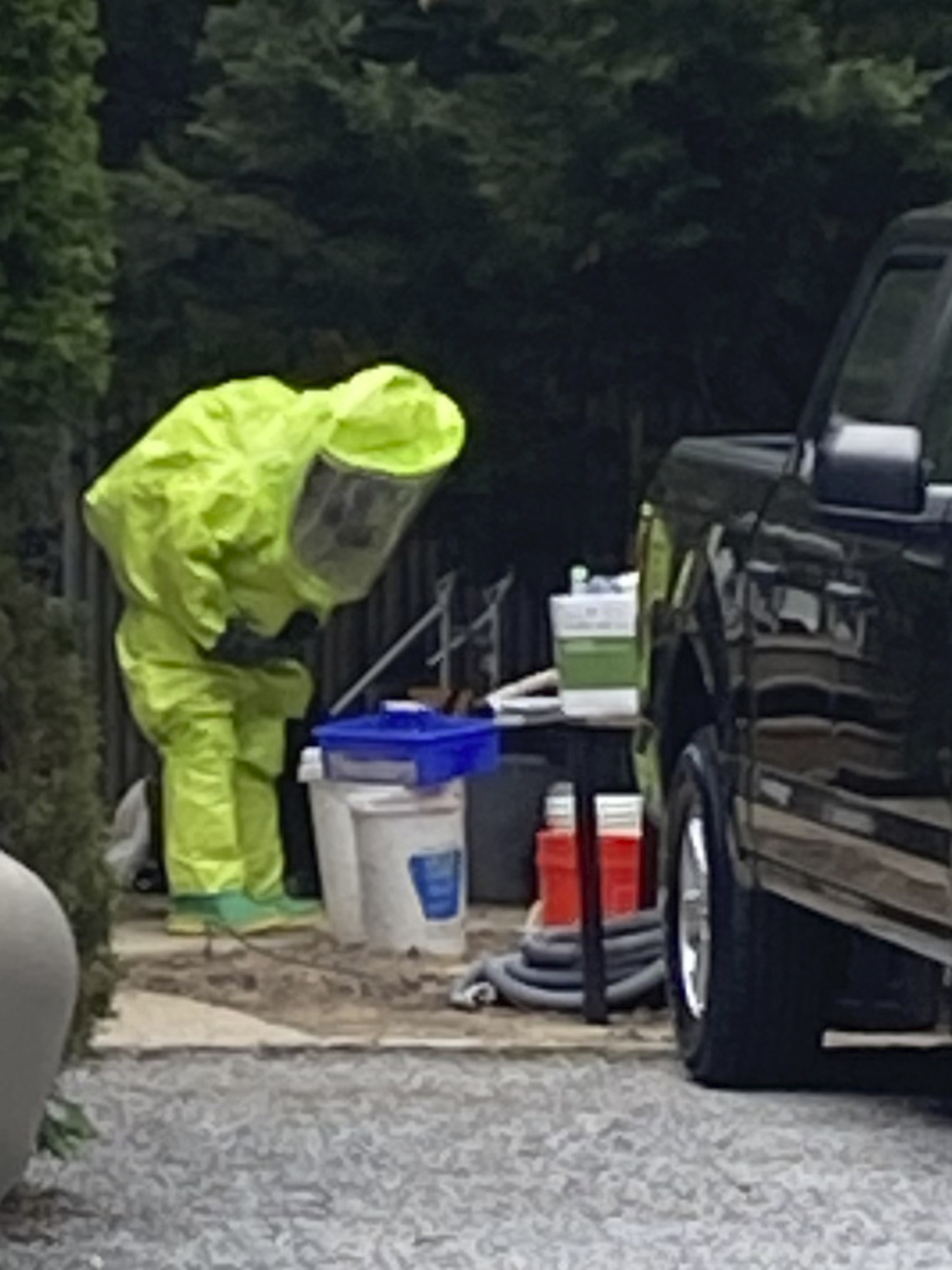 Garbed in the highest level protective gear, haz-mat  responders searched the site for more potentially explosive chemicals.