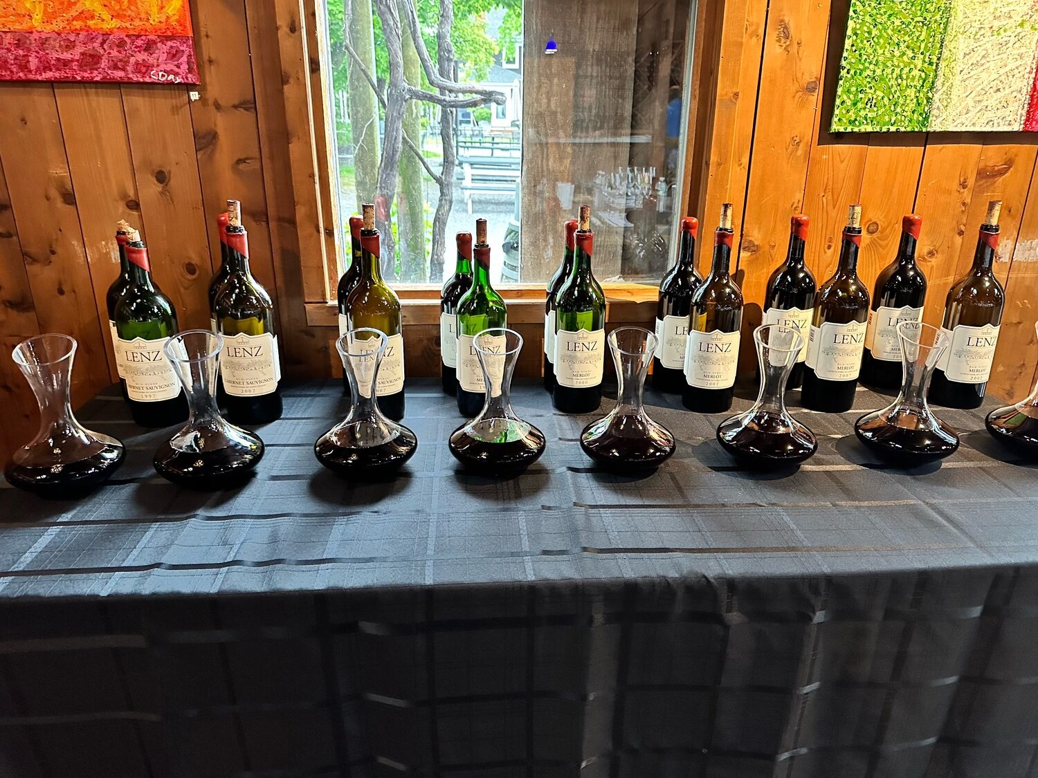 Guests taste from magnums dating back to 1997 during a Library Wine Tasting at Lenz Winery in Peconic. COURTESY LENZ WINERY