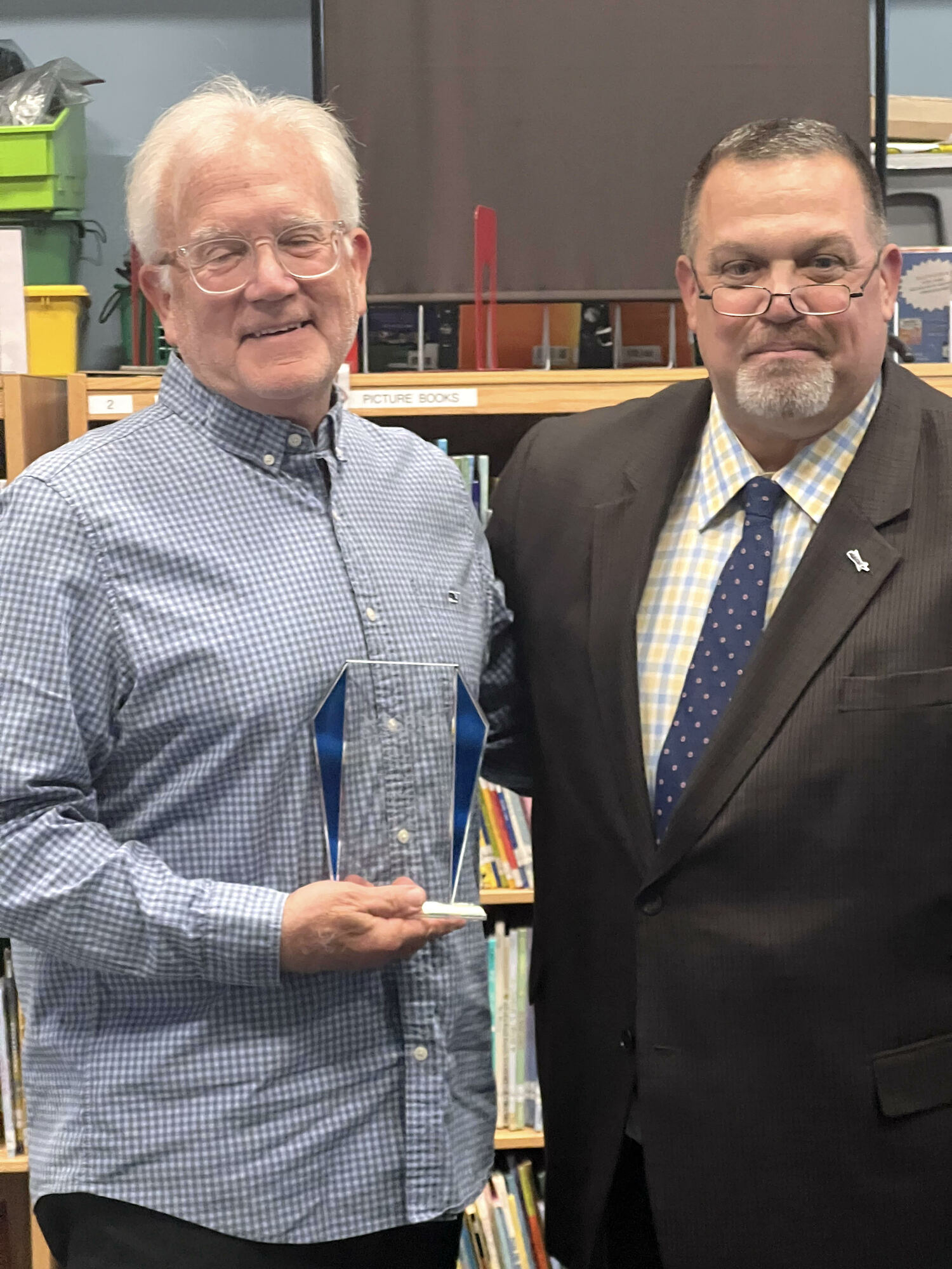 Springs School Board of Education Vice President Tim Frazier with his Outstanding School Board Service Award bestowed upon him by Nassau-Suffolk School Boards Association Executive Director Bob Vecchio. DEBRA WINTER