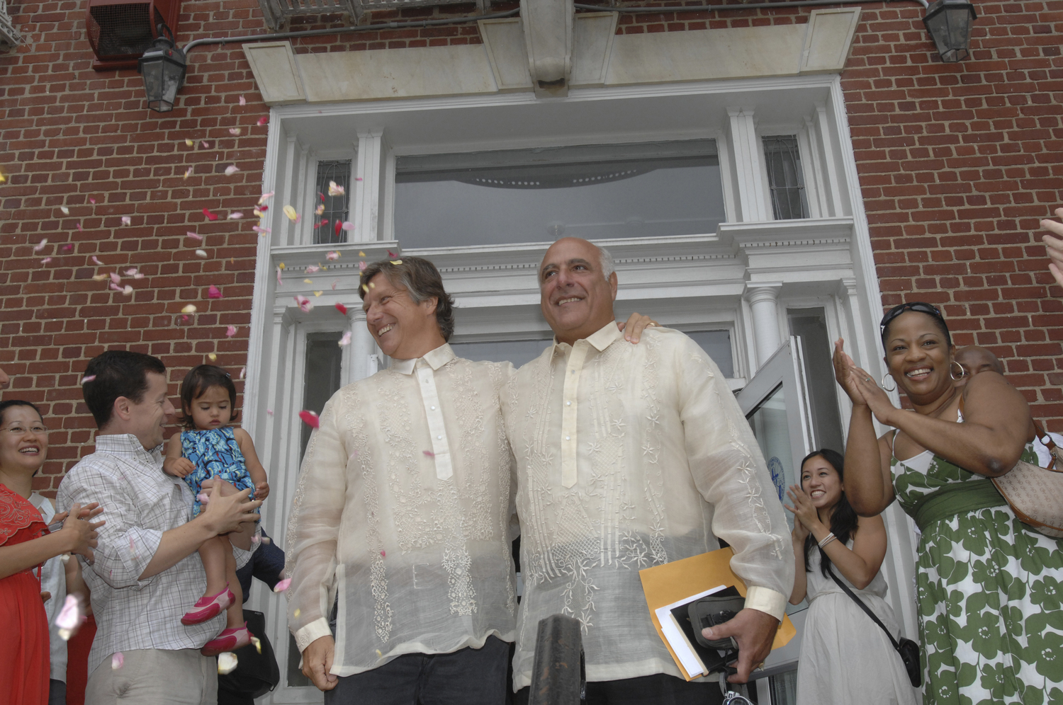 Frederic Rambaud and Alan Ceppos were the very first same-sex couple wed by Southampton Town Clerk Sundy Schermeyer in 2011.  DANA SHAW