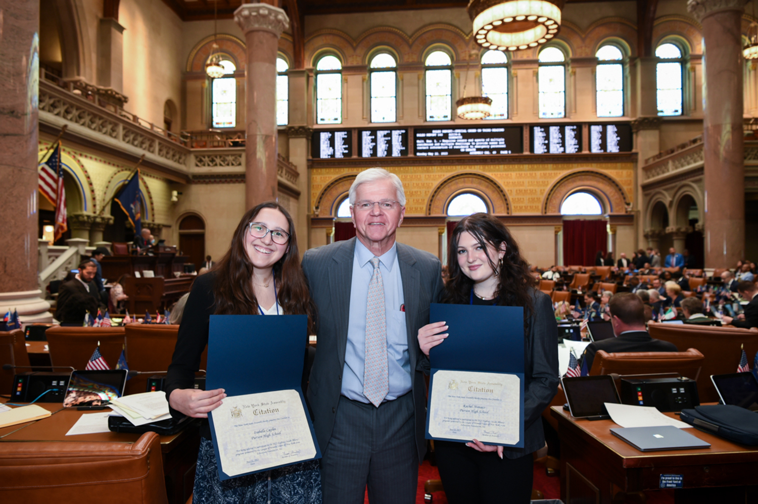 Two Pierson High School students, Isabelle Caplin and Rachel Monaco, were selected to
represent the Hamptons, Shelter Island and the North Fork by the League of Women Voters'
Youth Committee last month at the League of Women Voters Student in Albany Conference.
While at the conference they met with Assemblyman Fred Thiele. COURTESY LWV