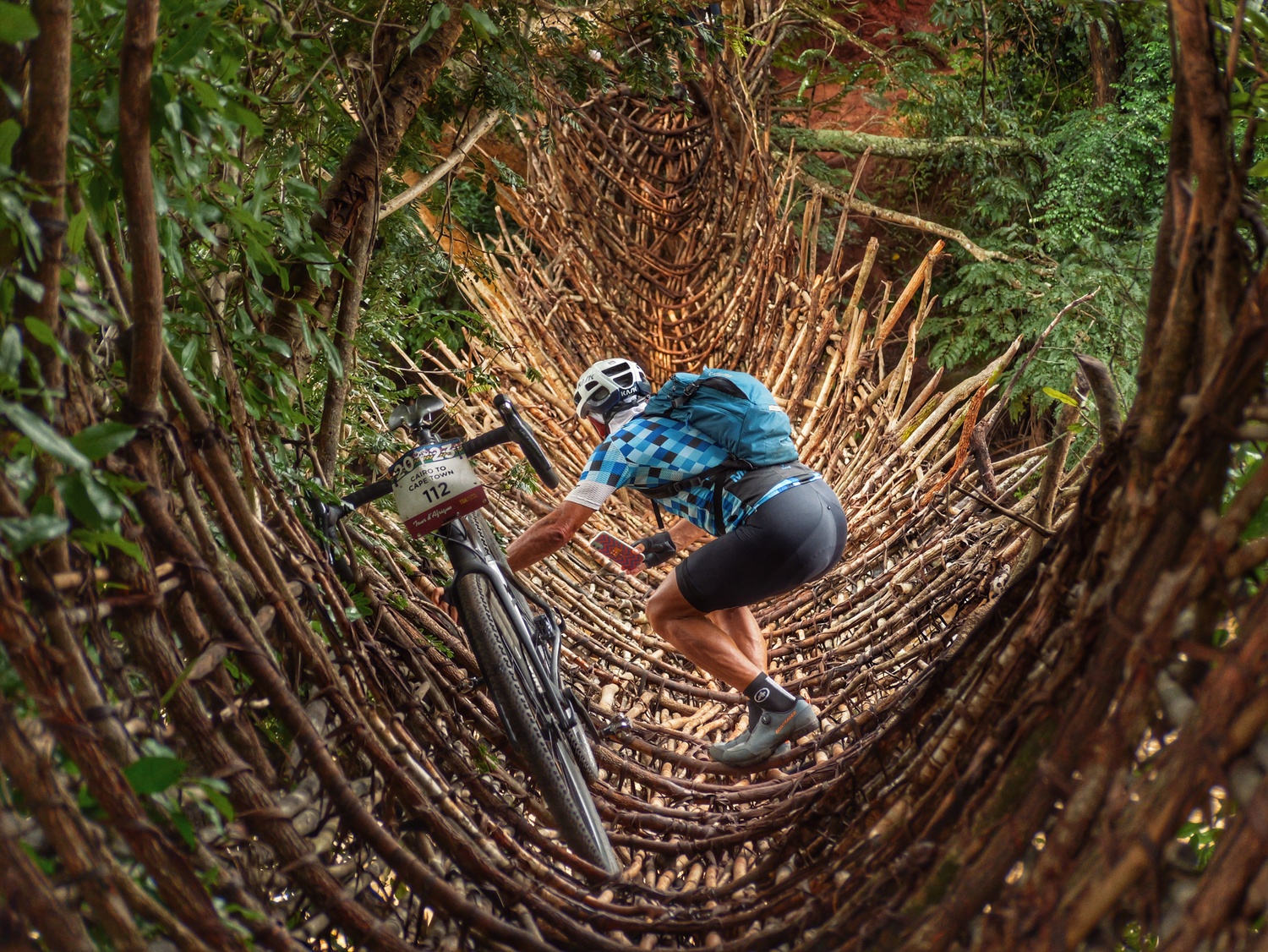 A bridge of vine and rope near Mzuzu, Malawi. COURTESY JOE LOUCHHEIM