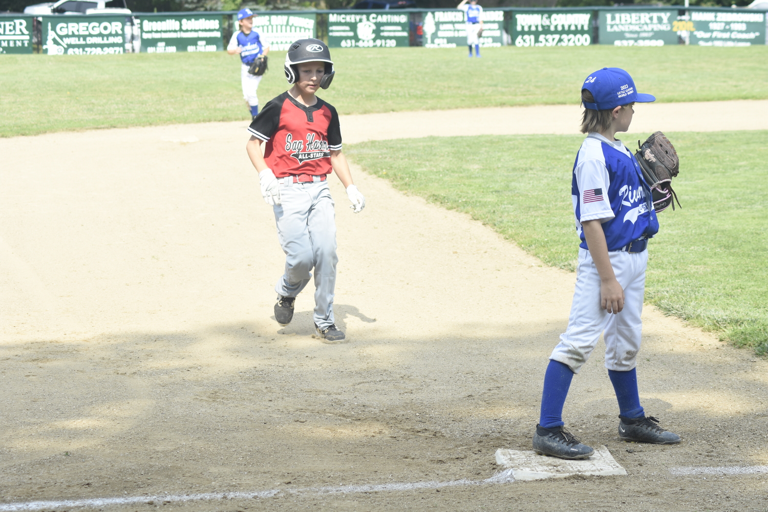 Frank Sokolowski heads in to the third base after a wild pitch.   DREW BUDD