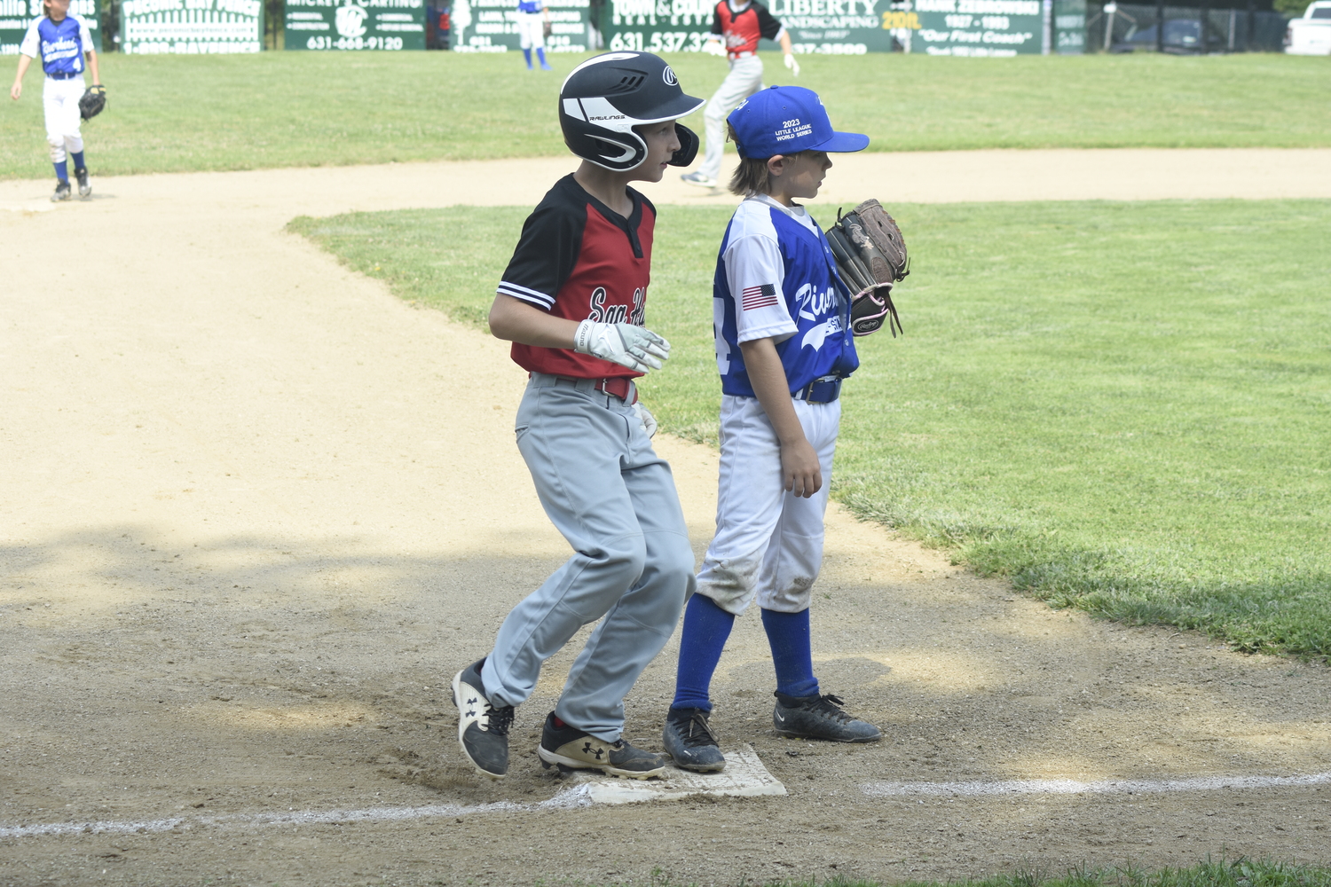 Frank Sokolowski heads in to the third base after a wild pitch.   DREW BUDD