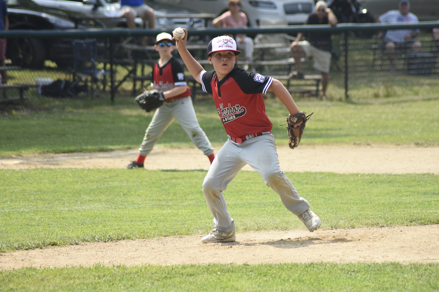 Jace Birdsall looks to throw to first base after fielding a ground ball on the mount.   DREW BUDD