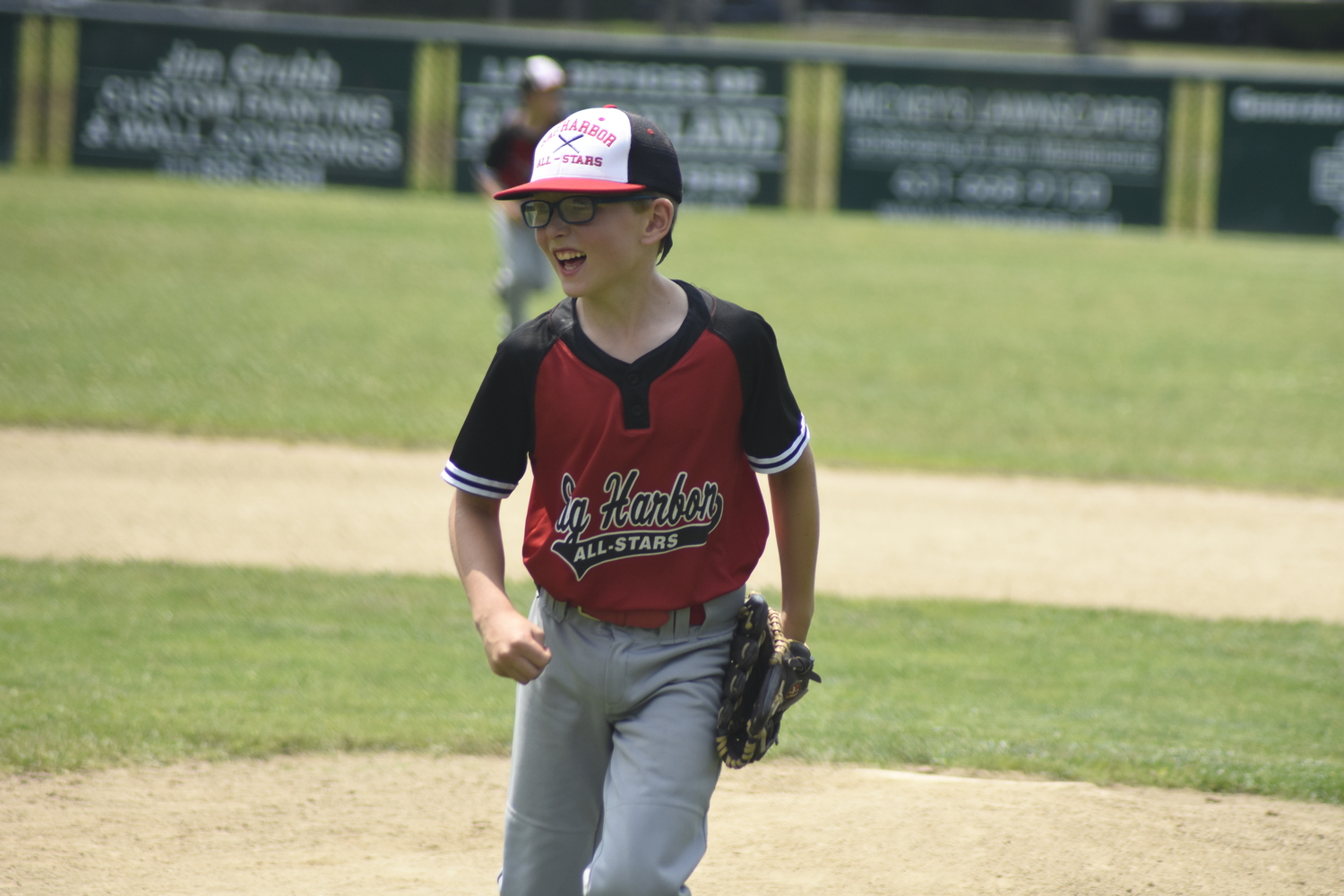 J.B. Ziglar is all smiles after striking out the final batter of Saturday's game to improve the 10U All-Stars to 4-0.   DREW BUDD