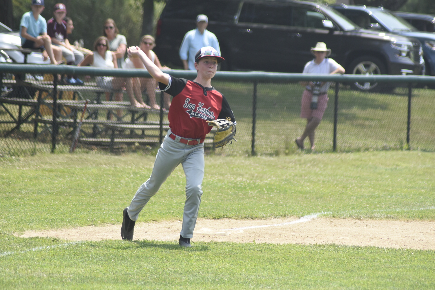 Sag Harbor 12U baseball All-Star Jaxson Schumann throws to first base after fielding a ground ball cleanly. DREW BUDD