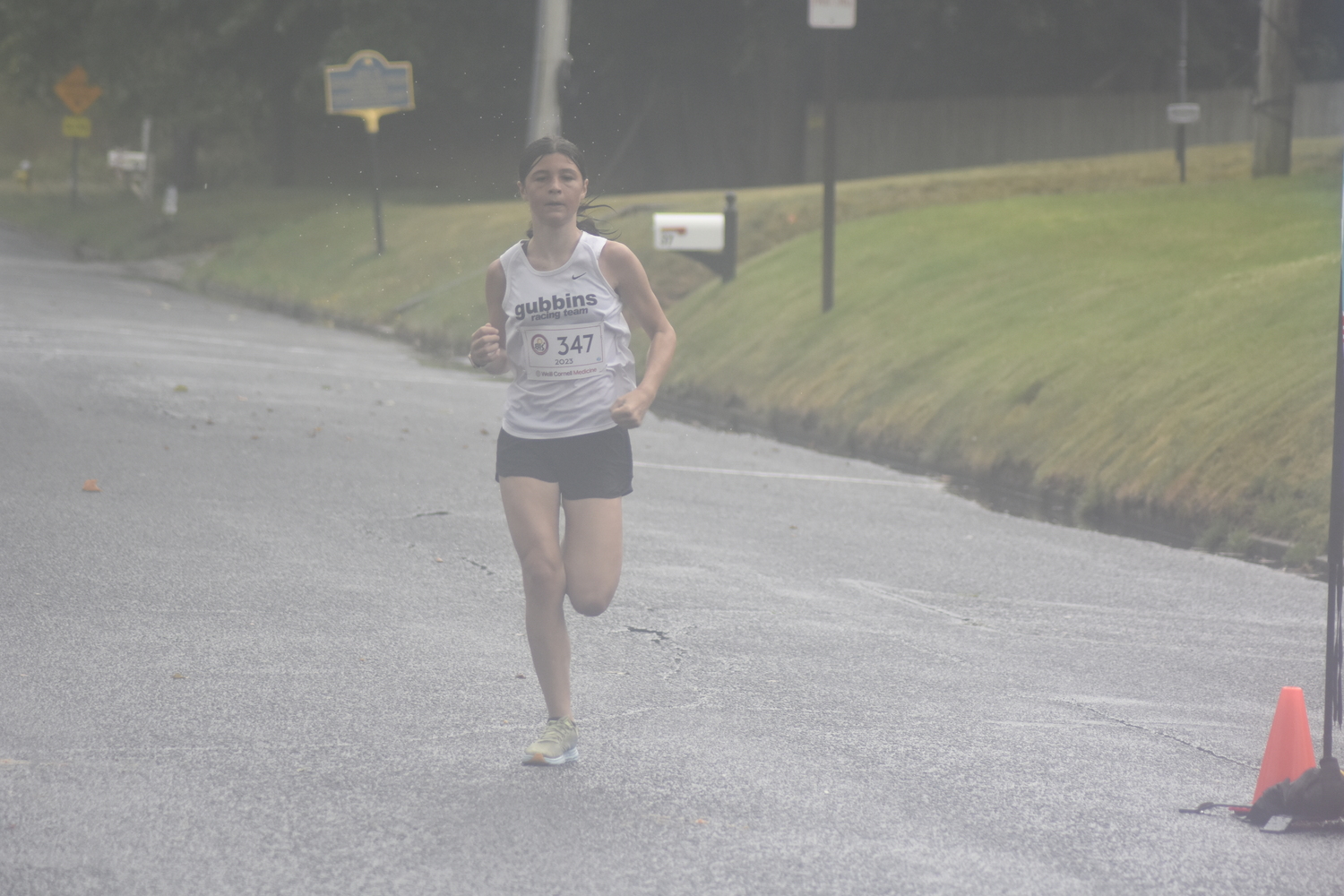 Clare Farrell, 12, of East Quogue was the overall winner of the 3-mile race.   DREW BUDD