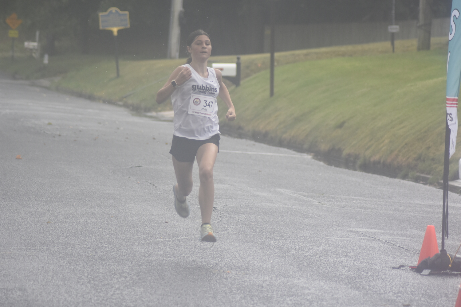 Clare Farrell, 12, of East Quogue was the overall winner of the 3-mile race.   DREW BUDD