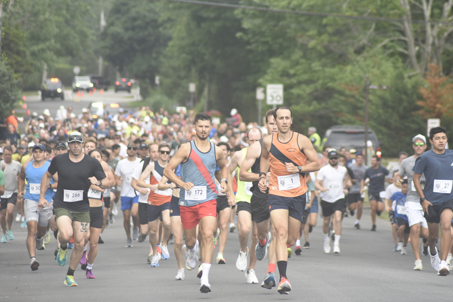 Sergey Avramenko and Jeffrey Ares lead the pack of runners at the start of the 31st annual Joe Koziarz Memorial 5K in Westhampton Beach on Saturday morning.   DREW BUDD