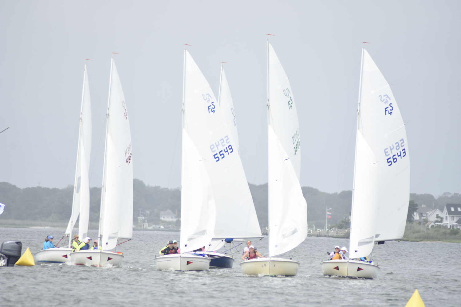 Boats jostle for position just before the start of the race.   DREW BUDD