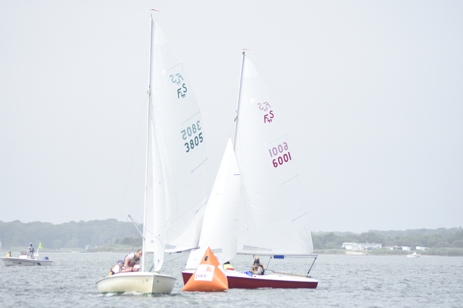 A pair of boats get around the first marker.  DREW BUDD