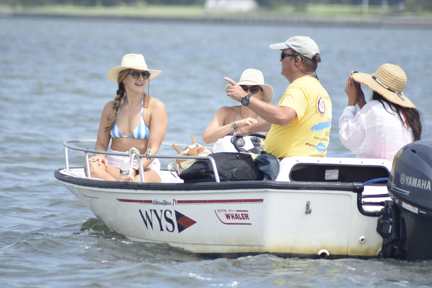 Onlookers take in some sailing.  DREW BUDD