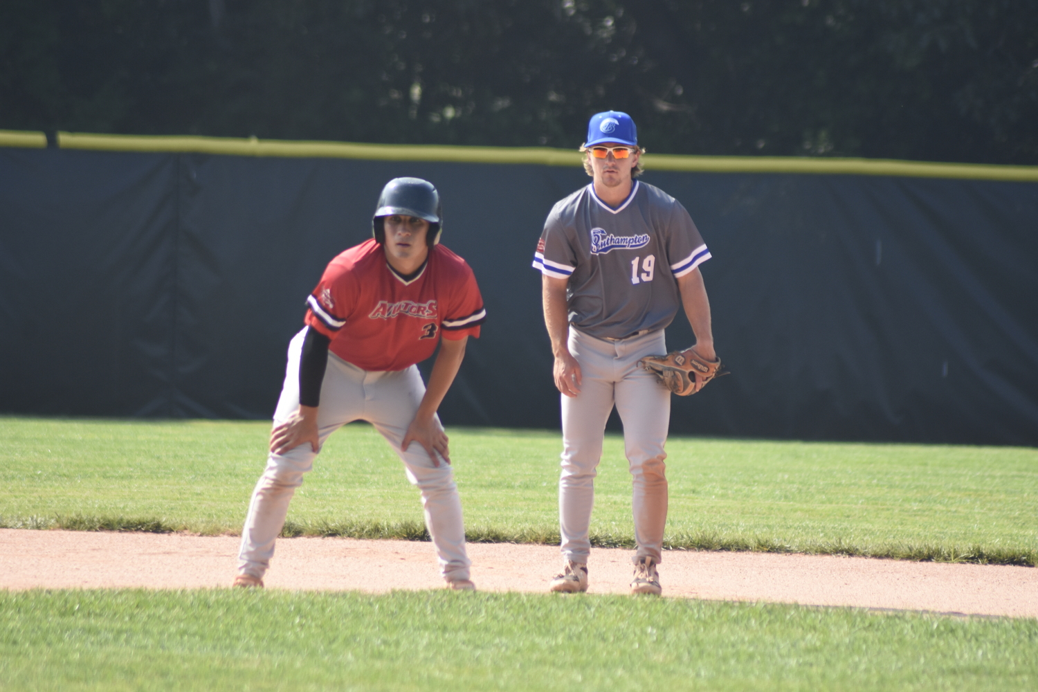 Southampton Breakers shortstop Chad Pike (Oklahoma City) holds on Westhampton Aviator Ethan Guerra (Paris JC) off of second base.   DREW BUDD